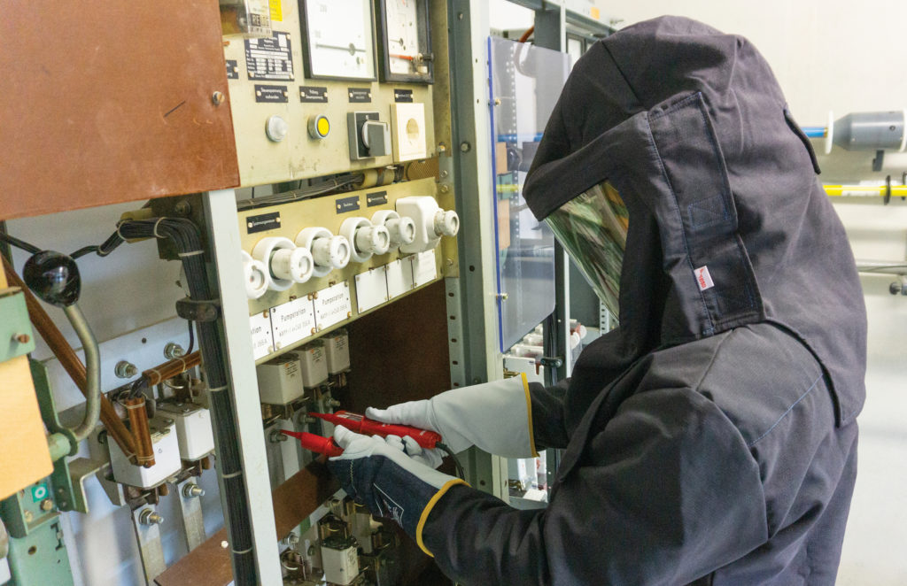 Operator wearing arc flash PPE